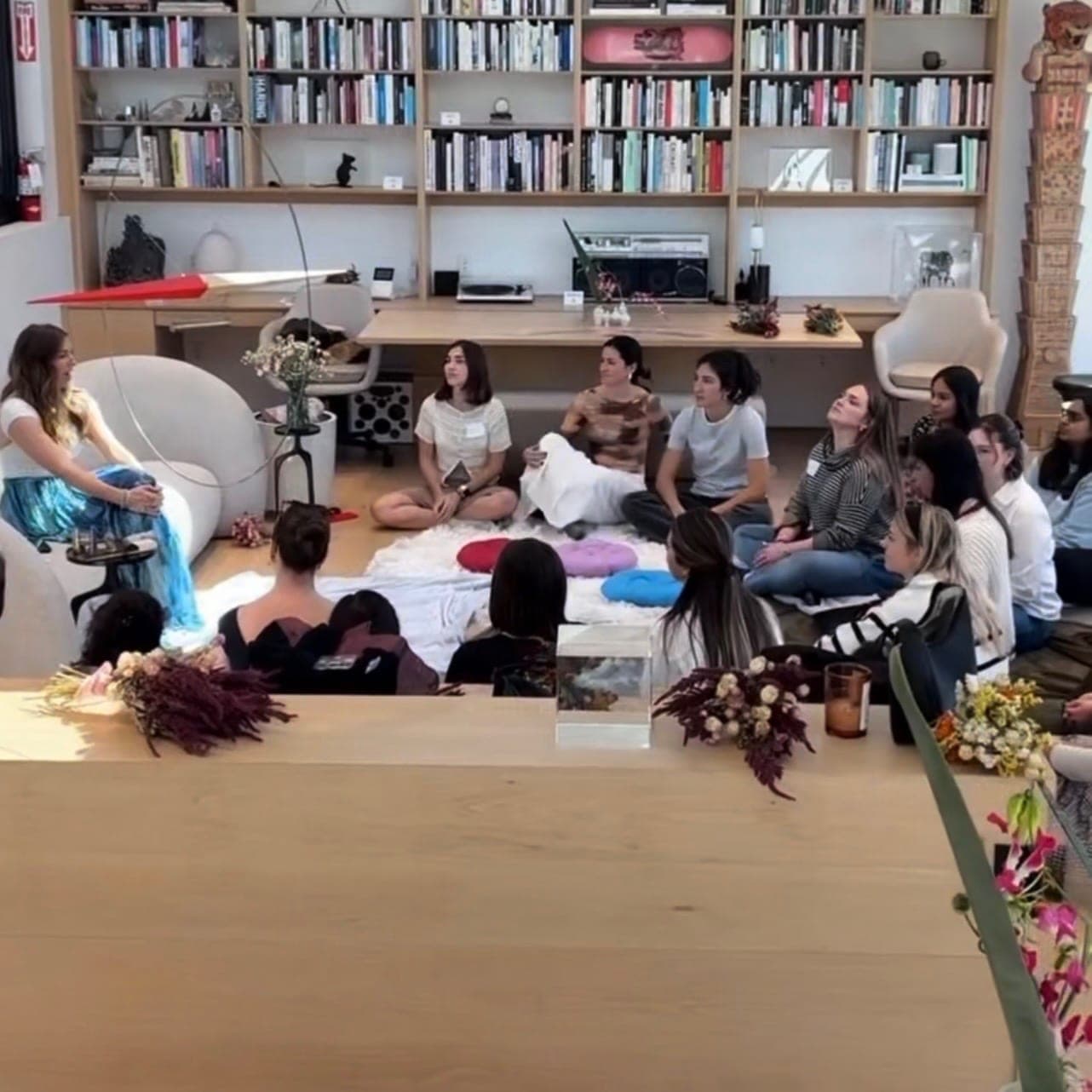A sharing circle in a sunlit library